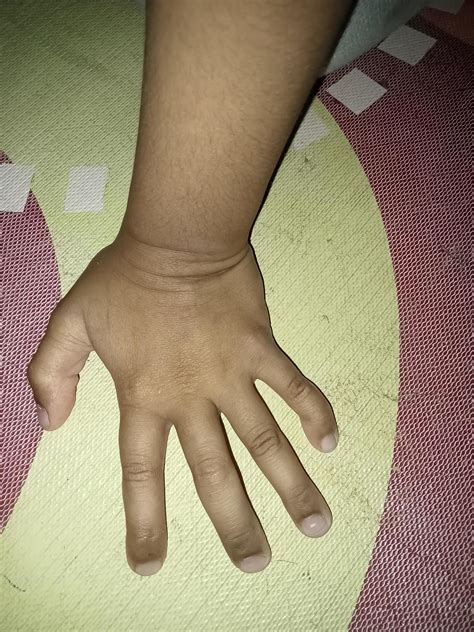 child's hands resting on the floor 19863351 Stock Photo at Vecteezy