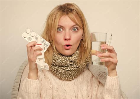 Premium Photo | Take pills relieve fever drink plenty of fluids girl ...