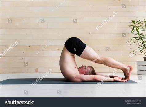 Sporty Man Practicing Yoga Halasana Plough Stock Photo 1062660419 ...