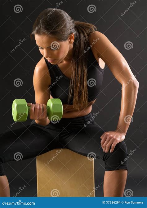 Woman Doing Seated Dumbbell Curl Stock Photo - Image of sport, beauty ...