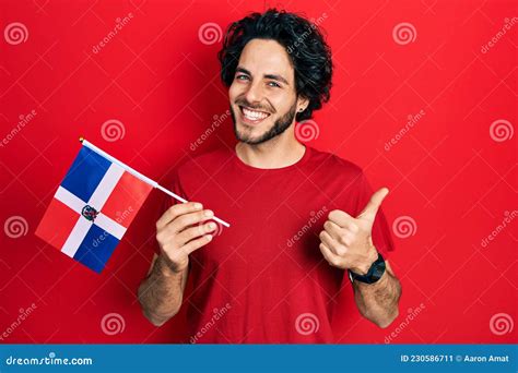Handsome Hispanic Man Holding Dominican Republic Flag Smiling Happy and ...