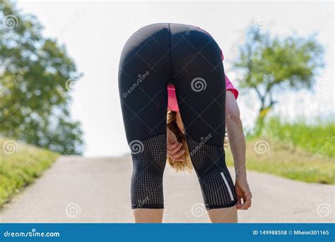 Athletic Fit Woman Bending Over Viewed from Rear Stock Photo - Image of ...