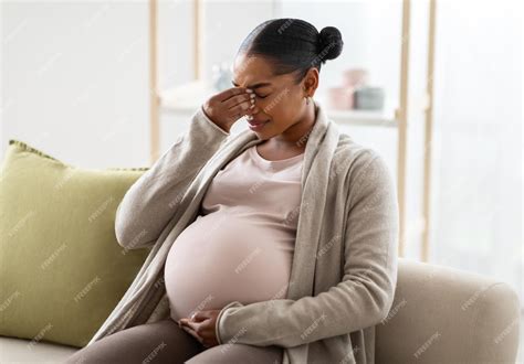 Premium Photo | Young pregnant black woman suffering from headache or migraine
