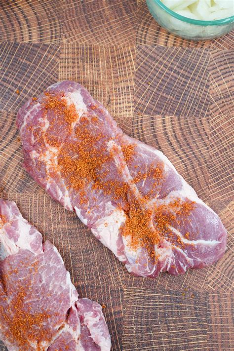 Smoked Pork Steaks with Beer Braised Onions • Smoked Meat Sunday