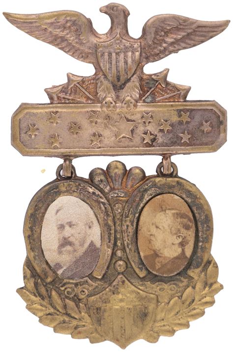 Hake's - HARRISON & MORTON ORNATE JUGATE SHELL BADGE.