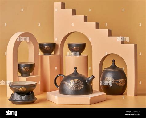 A variety of delicately crafted ceramic teacups and teapots, arranged ...