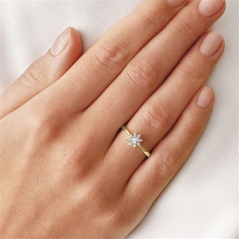 Yellow Gold Engagement Ring On Finger