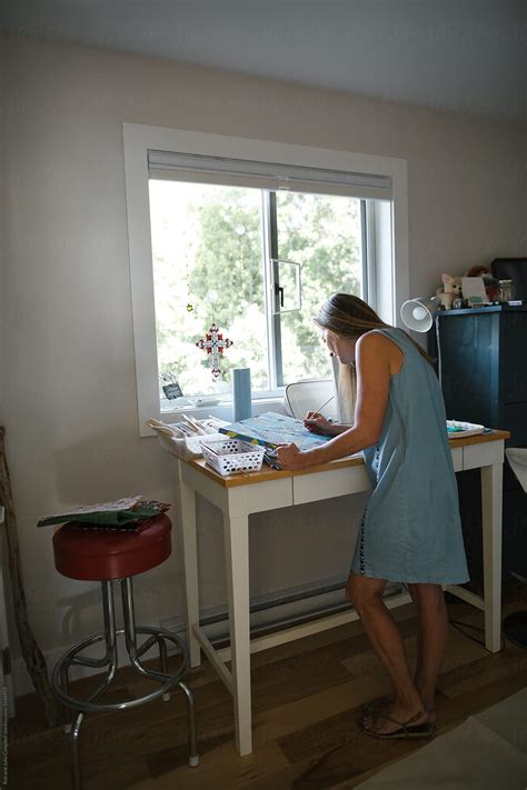 "Healthy, Artistic Mature Woman Relaxing In Art Studio" by Stocksy Contributor "Rob And Julia ...