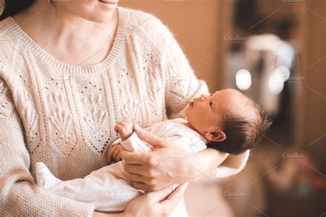 Mother holding baby girl | Stock Photos ~ Creative Market
