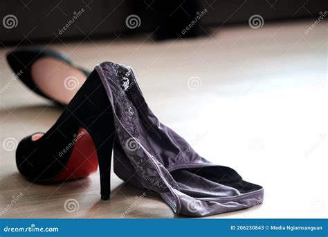 Women`s Underwear Laying on the Floor with Black Heels Bedroom ...