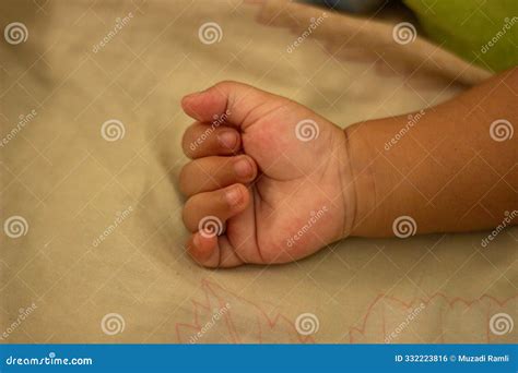 Baby Hands Clench into Fists while Sleeping Stock Photo - Image of hold ...