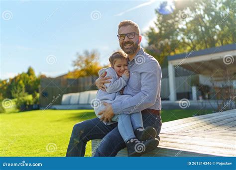 Father with His Little Daughter on Their Backyard during Sunny Autumn Day. Stock Photo - Image ...