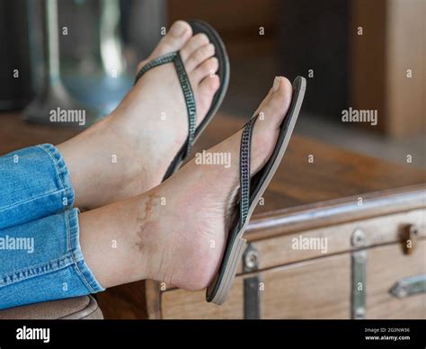 Woman flip flops jeans hi-res stock photography and images - Alamy