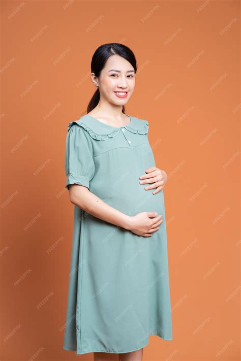 Premium Photo | Photo of asian pregnant woman on background
