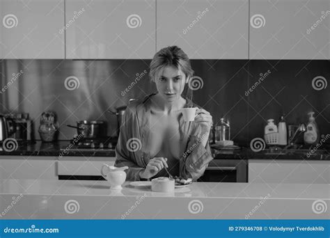 Housewife with Bare Breast Drink Coffee at Kitchen. Sensual Woman in the Kitchen in the Morning ...