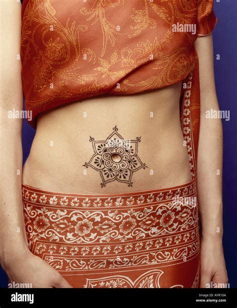 Henna belly button tattoo Stock Photo - Alamy