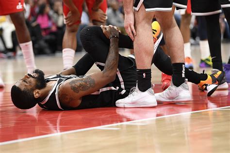 Kyrie Irving injures knee as Wizards top Nets - The Boston Globe
