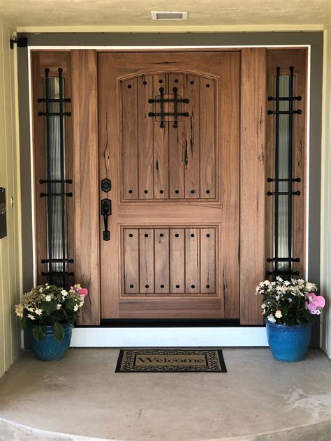 Beautiful Rustic Front Door with Flower Pots