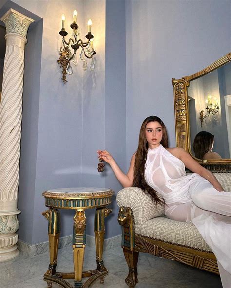 Demi Rose Shows Braless Chest Under Her Sheer White Dress