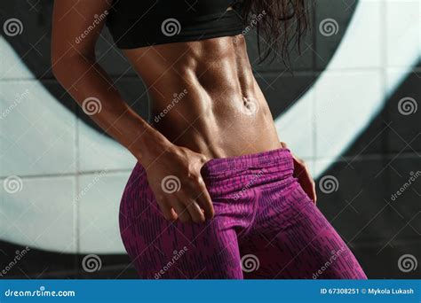 Fitness Woman Showing Abs and Flat Belly. Beautiful Muscular Girl ...