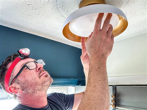 Joe Is Installing A Light Fixture at Beatrice Erickson blog