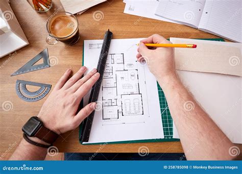 POV Shot of Male Architect Working in Office Measuring Plans for New Building Stock Photo ...