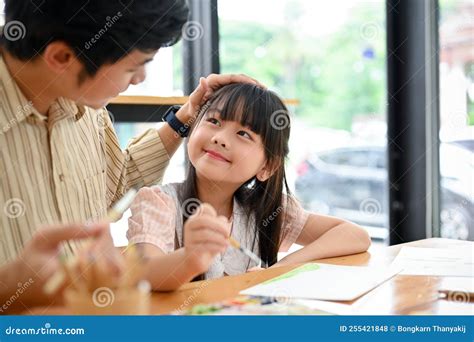 Happy Proud Asian Dad and Daughter Having Fun Together, Drawing and ...