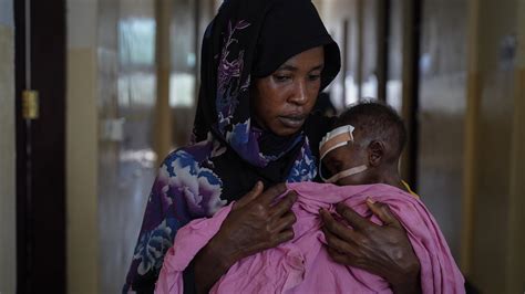 Opinion | Where Moms Hover Over Starving Children - The New York Times