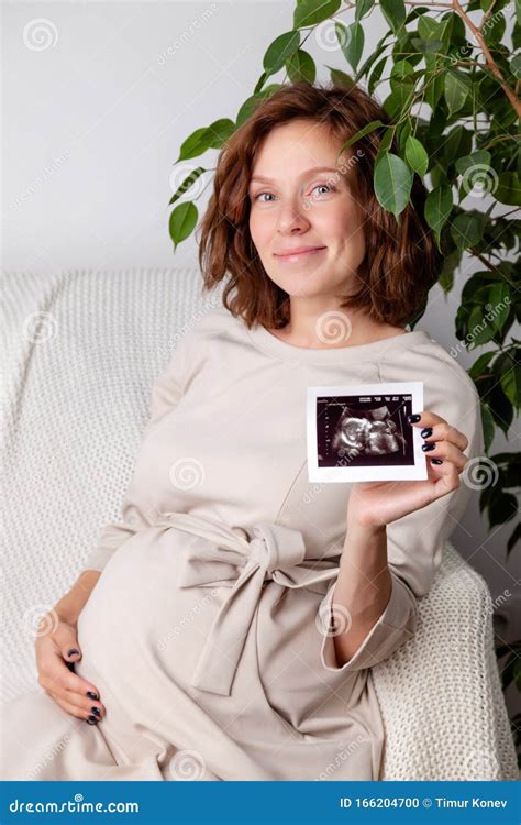 Pregnant Woman Holding Ultrasound Image. Concept of Pregnancy, Health ...