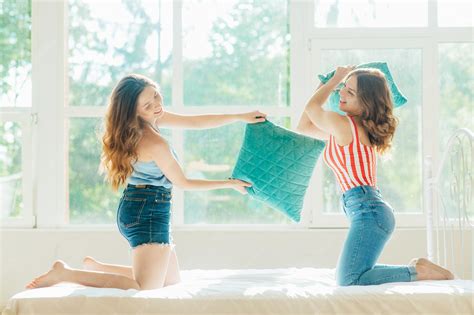 Premium Photo | Young sexy lesbian couple in underwear having fun with ...