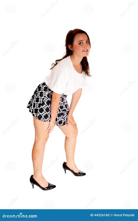 Teen girl bending down. stock photo. Image of modern - 44326160