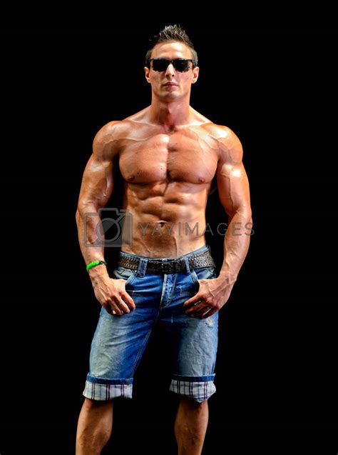 Handsome young muscle man naked wearing only jeans and sunglasses by ...