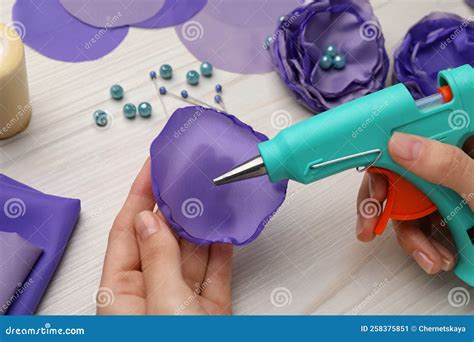 Woman with Hot Glue Gun Making Craft at Wooden Table, Closeup Stock ...