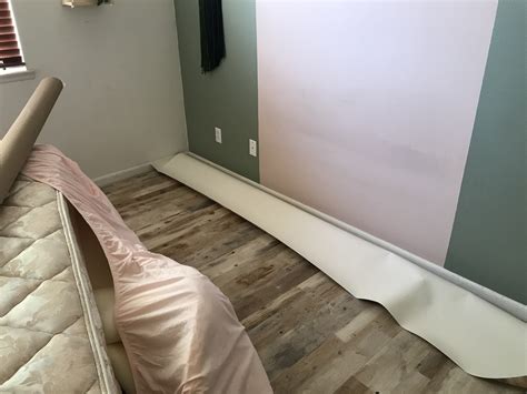 Temporary Flooring Over Carpet Just Started, Any Obvious Fixes?