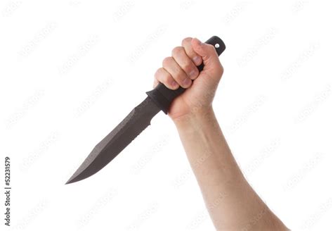 Hand holding combat knife Stock Photo | Adobe Stock