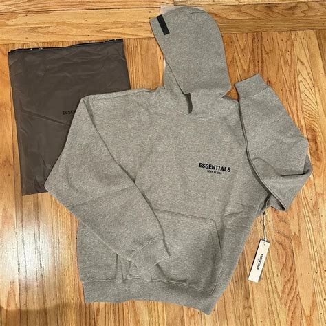 Grey essentials hoodie medium new - Depop