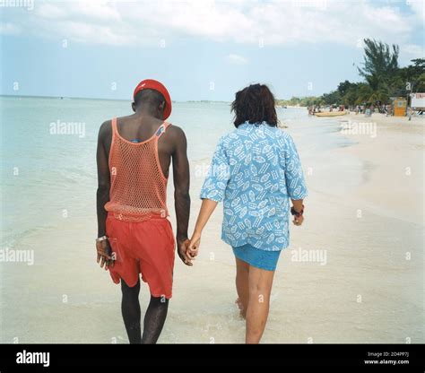A black man with a white woman on Negril beach, Jamaica Stock Photo - Alamy