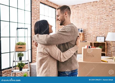 Man and Woman Couple Hugging Each Other Standing at New Home Stock ...