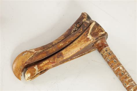 Lot 483 - A 19TH CENTURY SHARKS VERTEBRAE WALKING