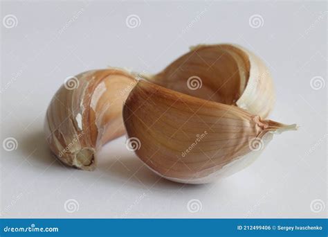 Three cloves of garlic. stock photo. Image of background - 212499406