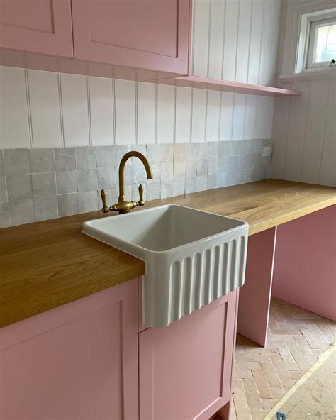 Pink-inspired Modern Laundry Room with Novi Fireclay Sink