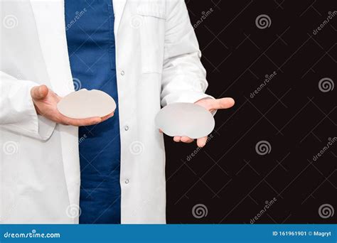 Doctor Holding Silicone Implant for Breast Augmentation, Space for Text. Plastic Surgeon Hands ...
