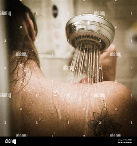 Woman in shower bathroom hi-res stock photography and images - Alamy