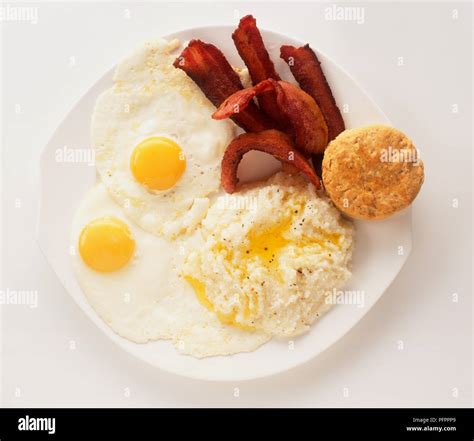 Florida-style breakfast consisting of two fried eggs, crispy rashers of ...