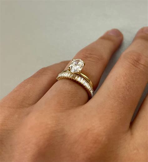 1.5 oval diamond on 4 prong gold solitare band with baguette wedding ...