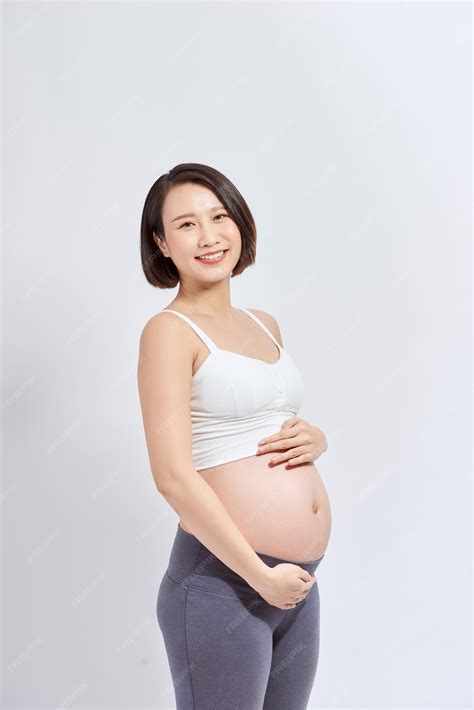 Premium Photo | Beautiful asian pregnant woman expecting baby and touching her belly