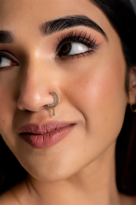 This diamond nath (nose ring) for women with pierced nostrils is an easy to wear item that goes ...