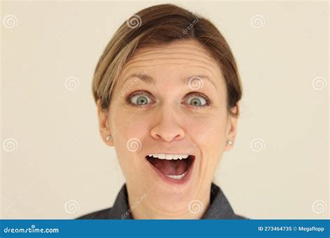 Woman with Active Facial Expressions Grimaces at Camera Stock Image ...