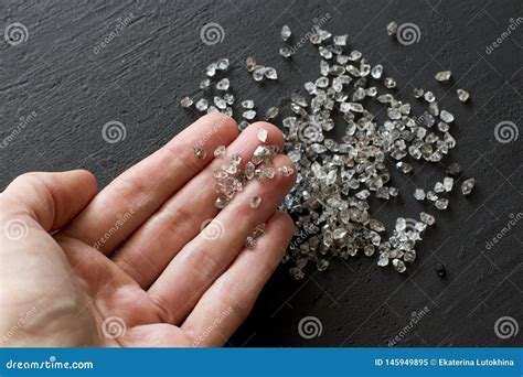 Raw Natural Diamonds, Graphite Quartz are in the Hand. a Scattering of ...