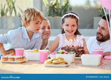 Are You Ready To Blow Out the Candles. a Little Girl Celebrating Her ...